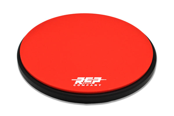 RCP Flex Series 12-inch double-sided drum practice pad red top rubber with black base and RCP logo